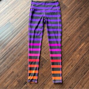 Athleta Bold Stripe Chaturanga Leggings XS Rainbow Purple Pink Orange 27” Inseam